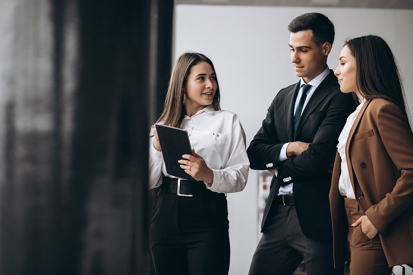 male-and-female-business-people-working-on-tablet-in-office